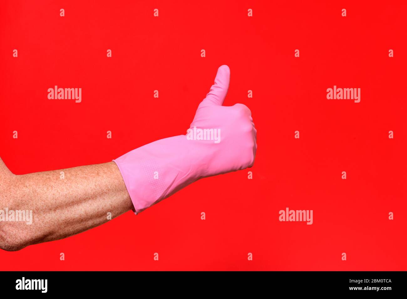 Hand in glove thumbs up hi-res stock photography and images - Alamy