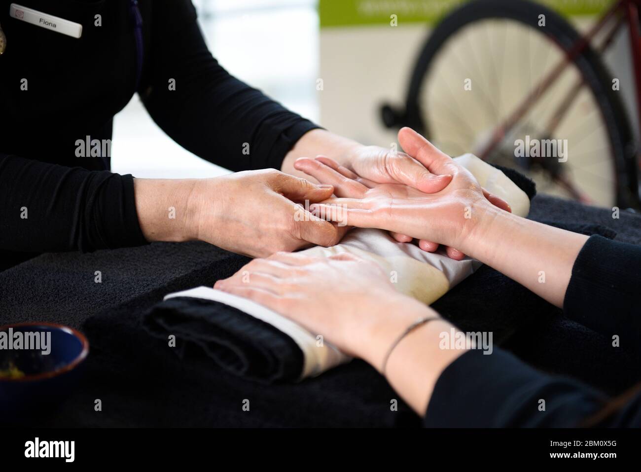 A hand massage session, sometimes known as hand reflexology. Hand