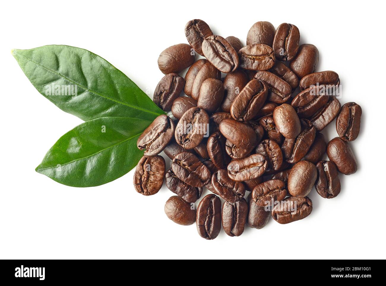 Heap of roasted coffee beans and leaves isolated on white background ...