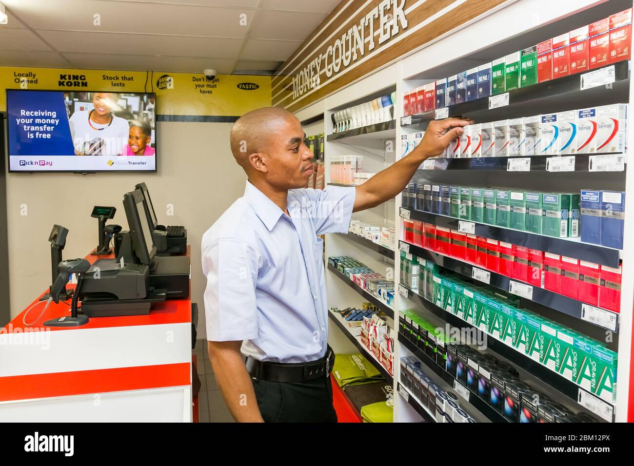 Johannesburg, South Africa November 22, 2016 Grocery store staff packing shelves at local