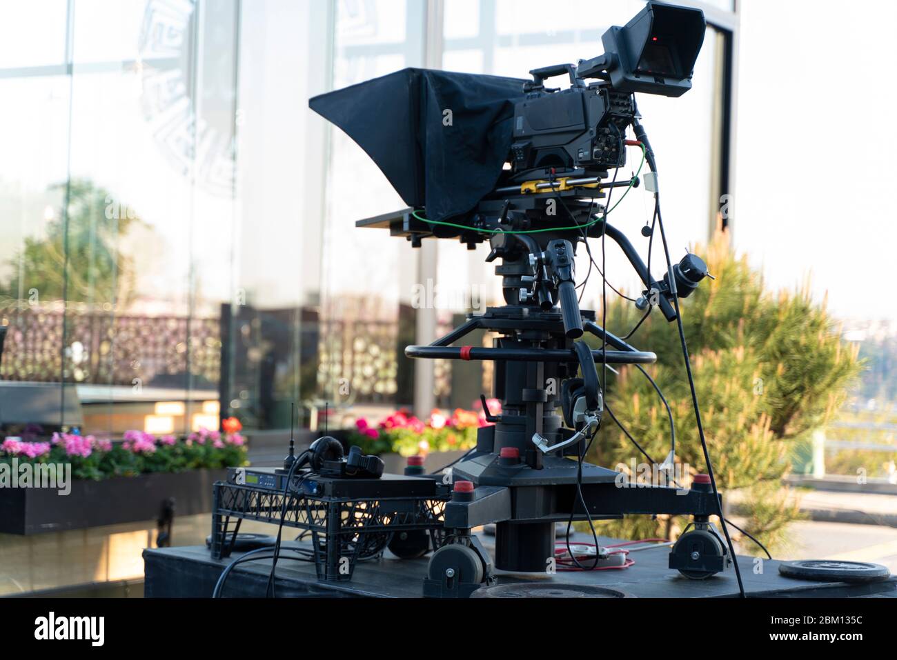 TV NEWS cast outdoors studio with camera and equipment Stock Photo