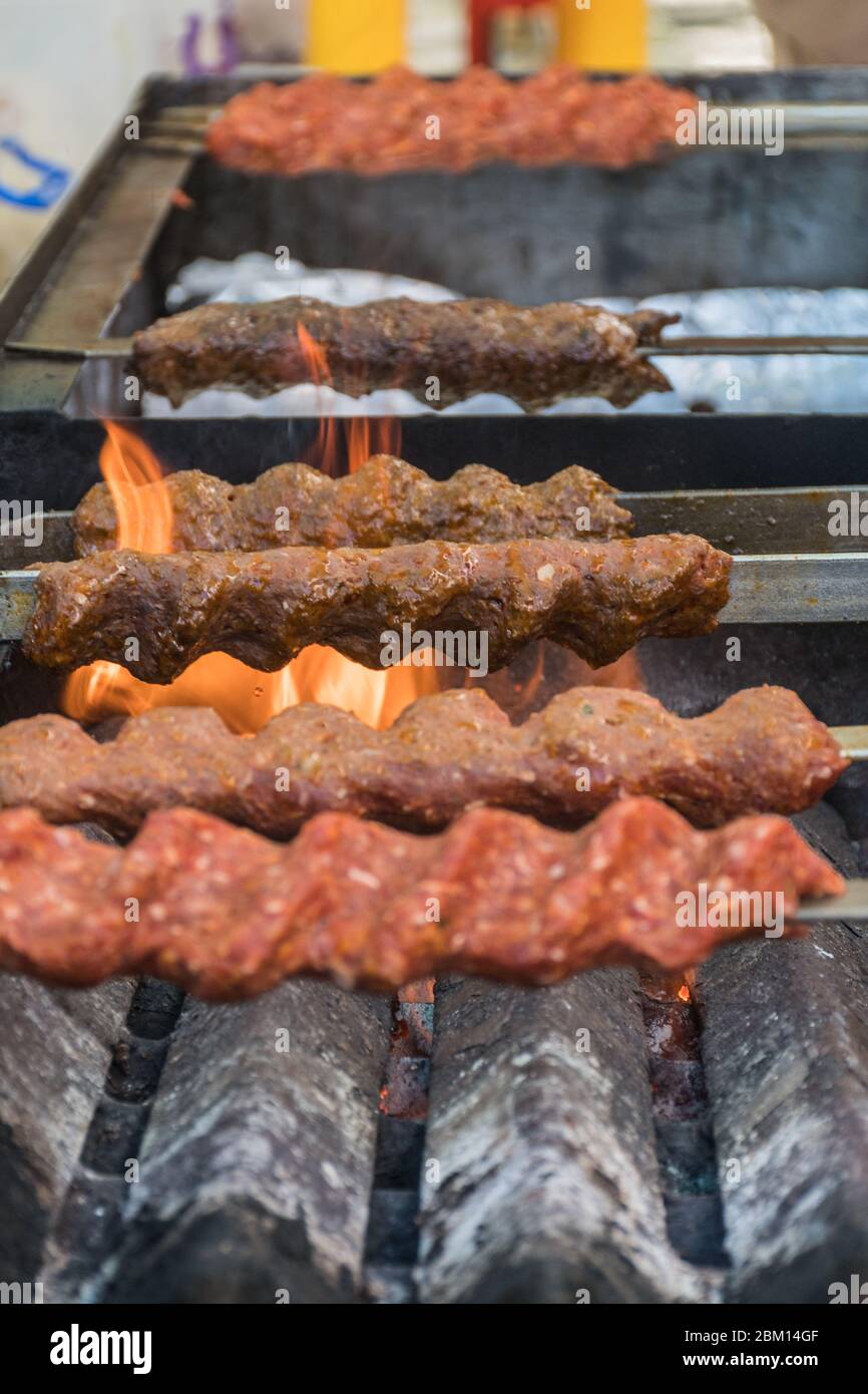 adana-kebab-ground-lamb-minced-meat-on-skewer-on-grill-over-charcoal