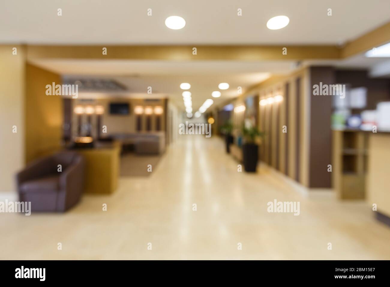 Blurred corridor with light lamps in hotel. Stock Photo