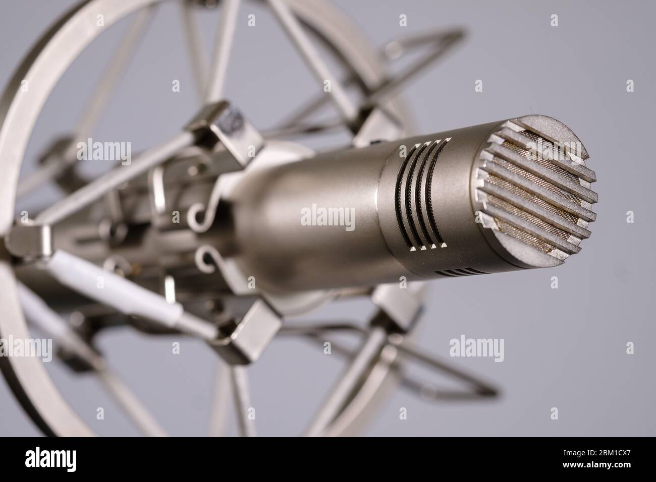 Small diaphragm condenser microphone in shock mount Stock Photo Alamy