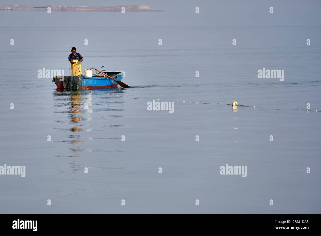 Fisherman working the lagoon near Paracas, Peru Stock Photo