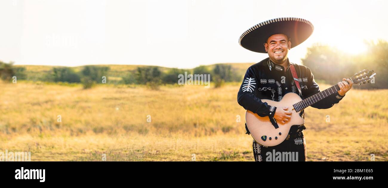 Mexican musician play guitar. Stock Photo