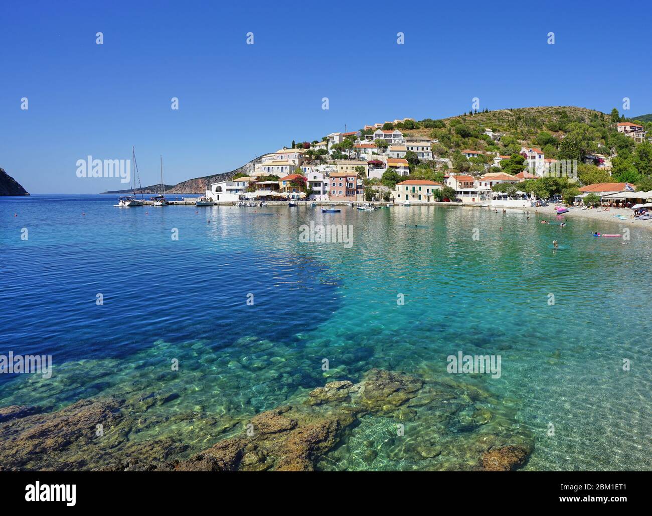 Asos village panorama and blue sea on a sunny day, Kefalonia (Cephalonia) Island, Ionian Sea, Mediterranean, Greece Stock Photo
