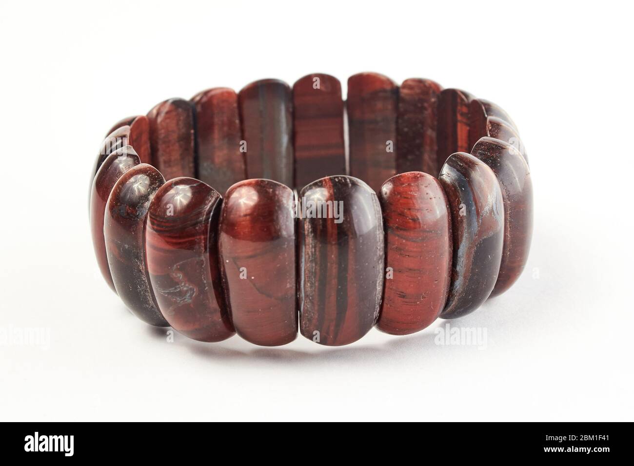 semi-precious stone bracelet from a bull's eye on a white background. close up Stock Photo