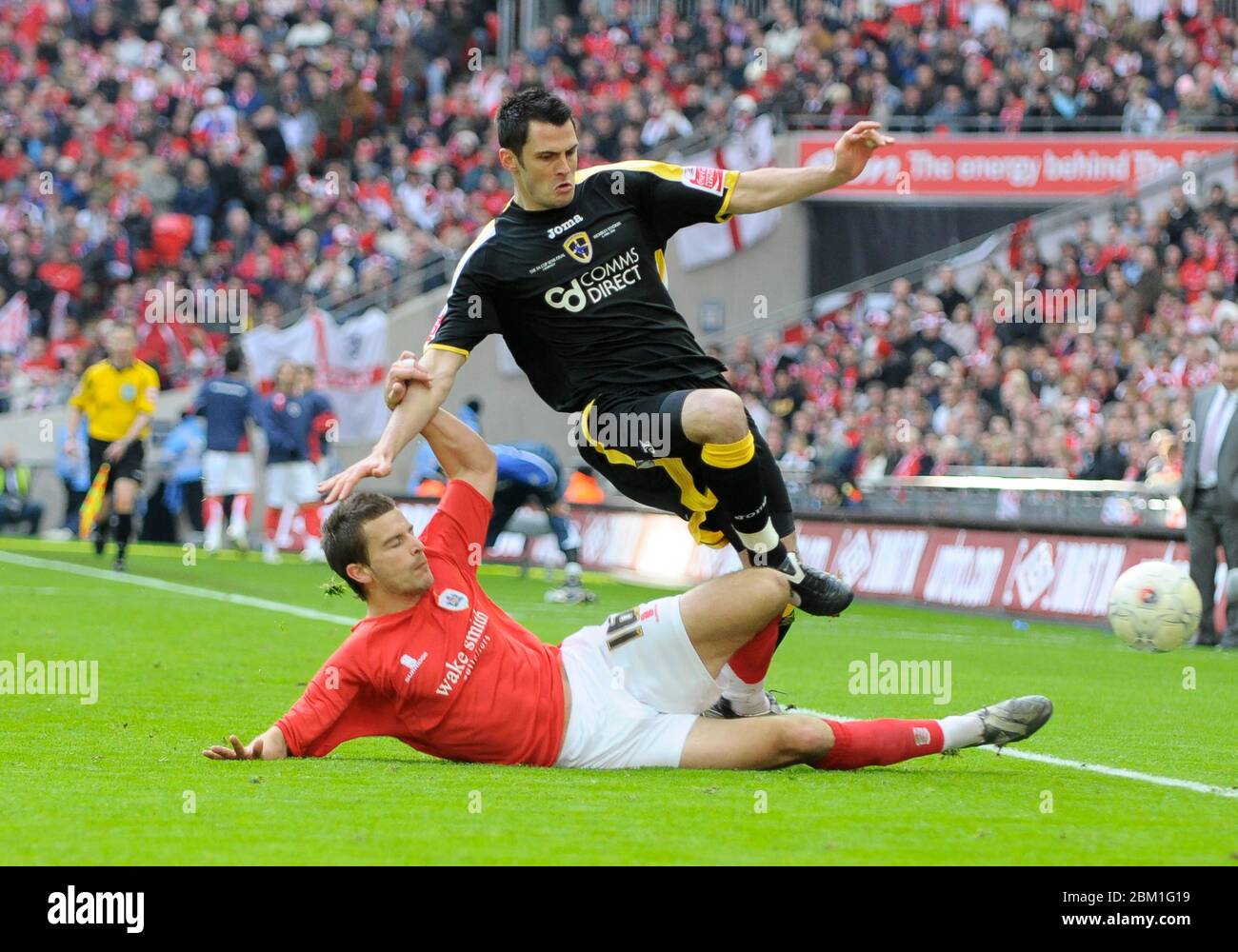 LONDON, UK. APRIL 06: L-R Stephen Foster of Barnsley tackles Steve Thompson of Cardiff City during FA Cup Semi-Final 2 between Barnsley and Cardiff Ci Stock Photo