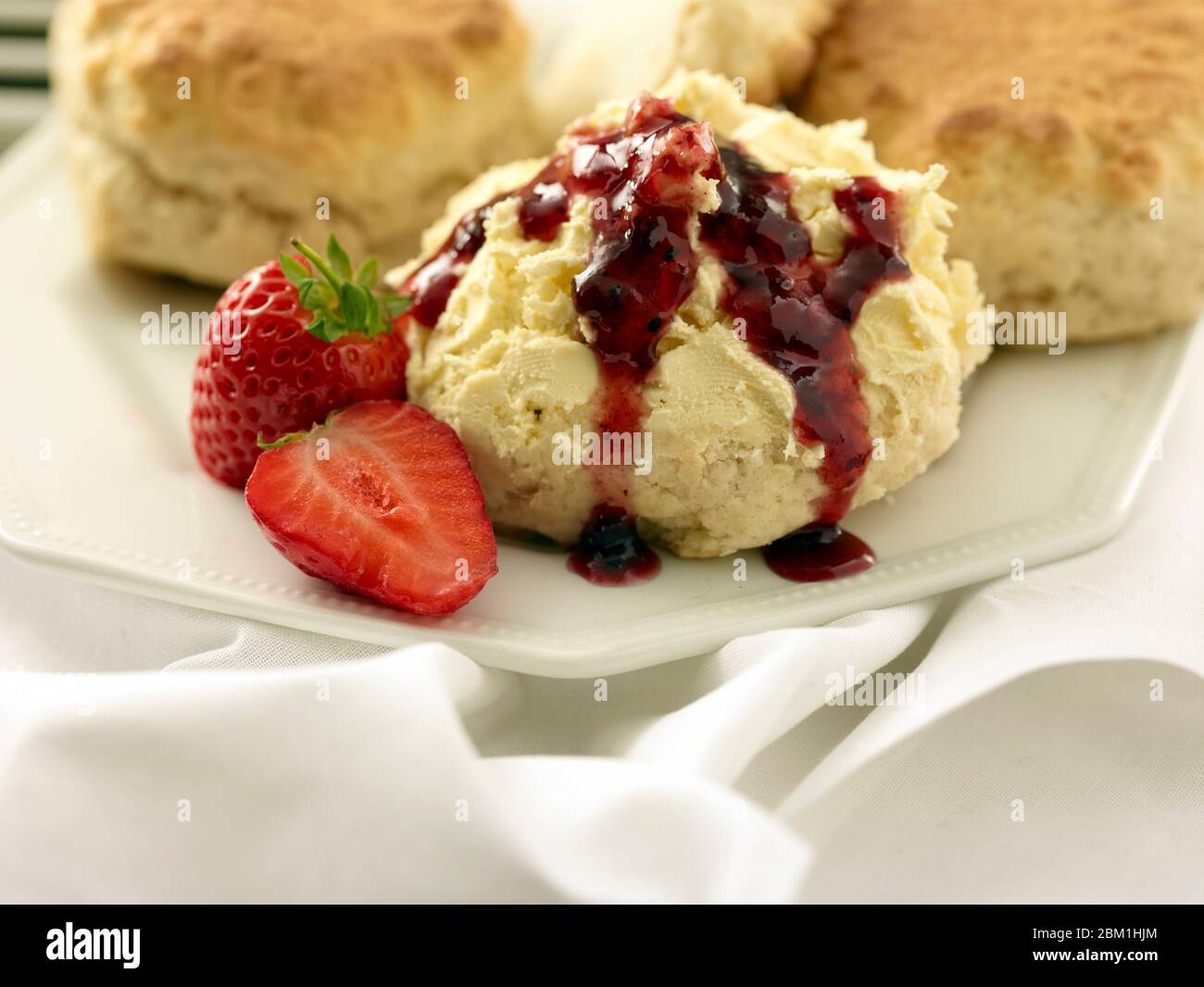 British cream tea, scones with clotted cream, strawberry jam and ...