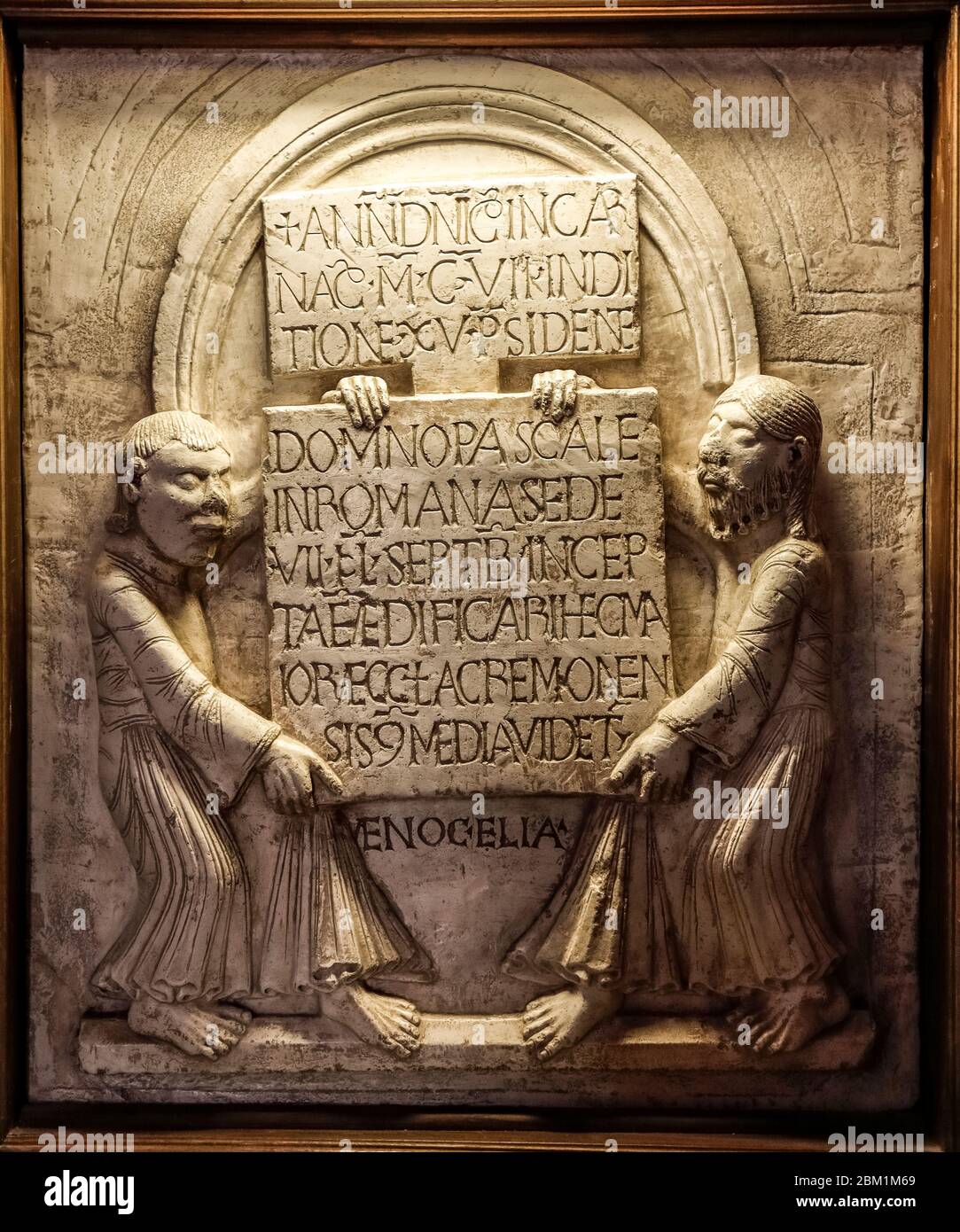 Italy Lombardy - Cremona: Baptistery -  Foundation epigraph (year 1107) with the prophets Enoch and Elijah Stock Photo