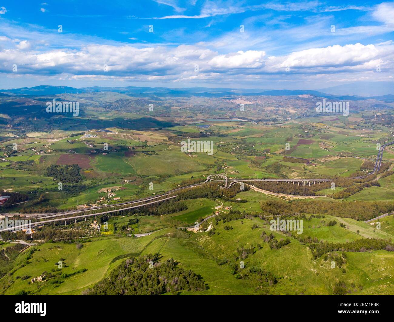Expressway highway Sicily island Italy, near city of Enna. Blue sky