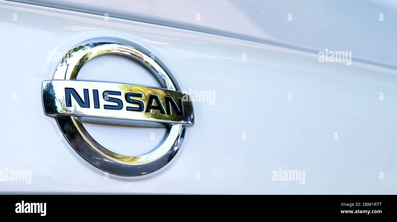 ISTANBUL, TURKEY - AUGUST 22, 2019: Nissan Company Logotype, on white car. Illustrative editorial. Stock Photo