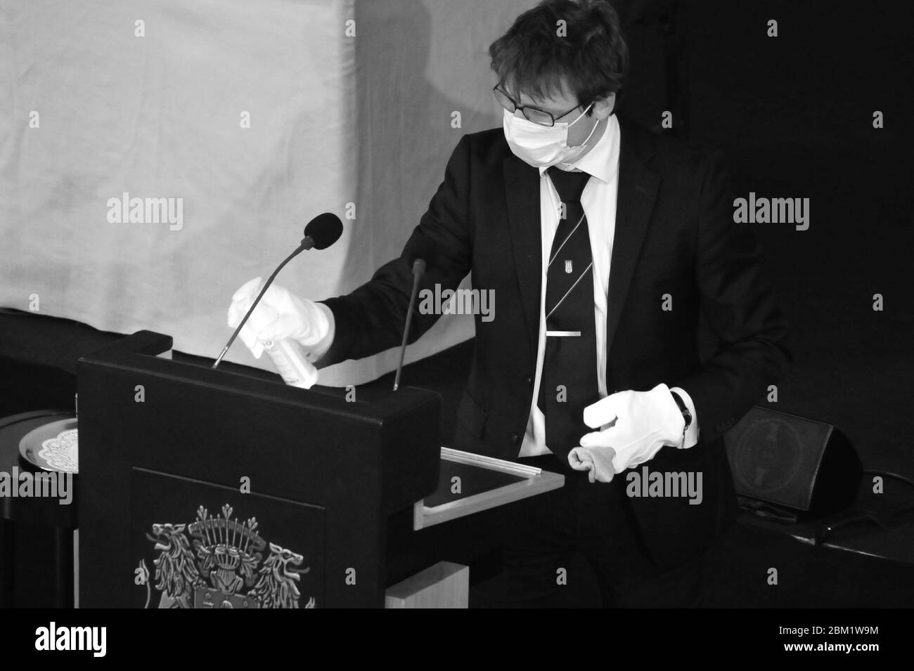 Hamburg citizenship plenary sitting at 06. May 2020 in the City Hall. Cleaning the lectern for the speakers of the different political groups, who are talking about solutions of the Corona crisis in Hamburg. Stock Photo