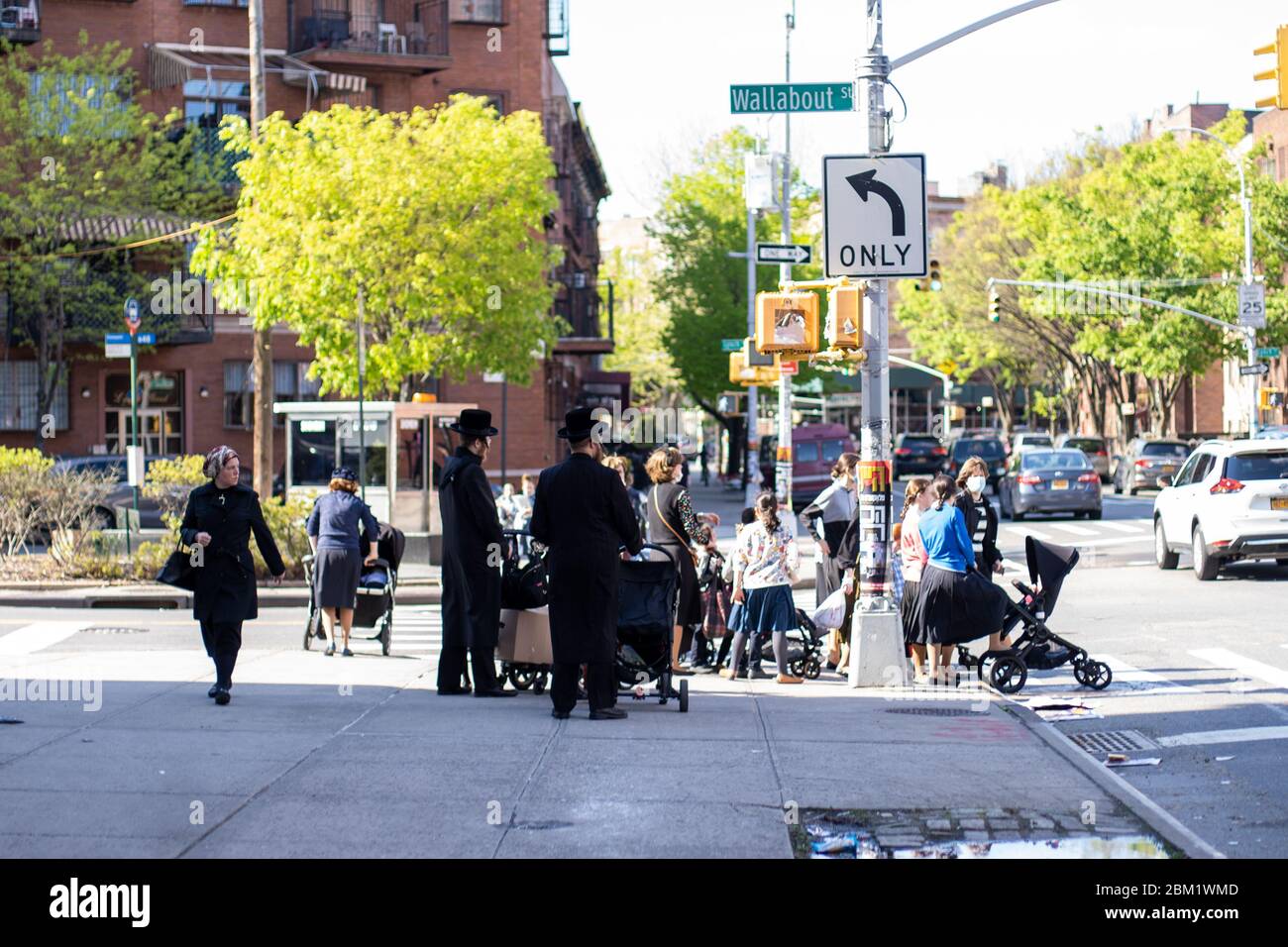 New York, USA - May 3 2020: Hasidic Jews Community and Children in Williamsburg Walking in Groups During Coronavirus COVID-19 Pandemic Stock Photo