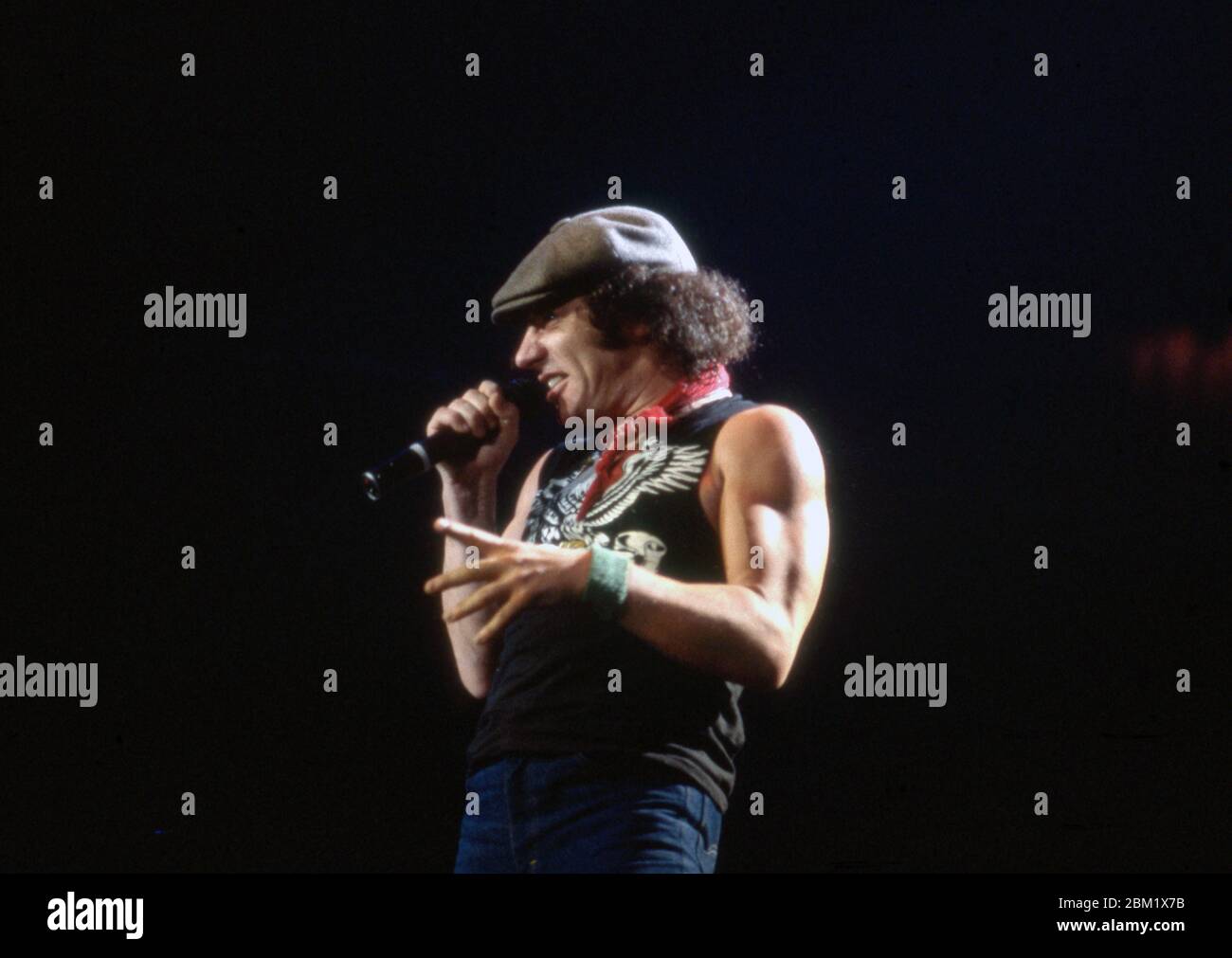 DETROIT - NOVEMBER 17: Brian Johnson, lead singer for AC/DC, performs during the Flick of the Switch/Monsters of Rock tour, on November 17, 1983, in Detroit, Michigan. (Photo by Ross Marino/Rock Negatives) Stock Photo