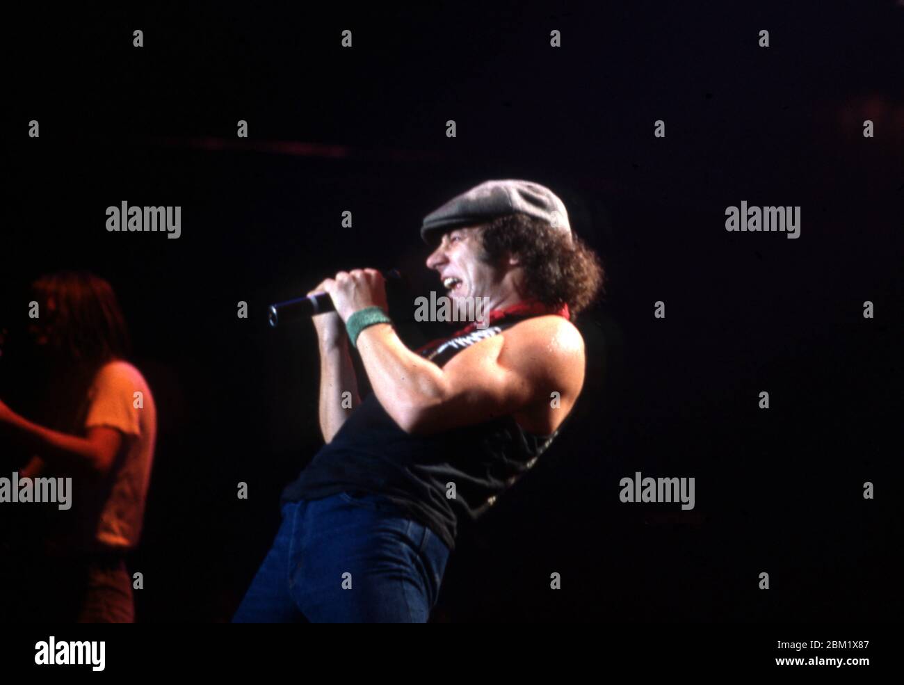 DETROIT - NOVEMBER 17: Brian Johnson, lead singer for AC/DC, performs during the Flick of the Switch/Monsters of Rock tour, on November 17, 1983, in Detroit, Michigan. (Photo by Ross Marino/Rock Negatives) Stock Photo
