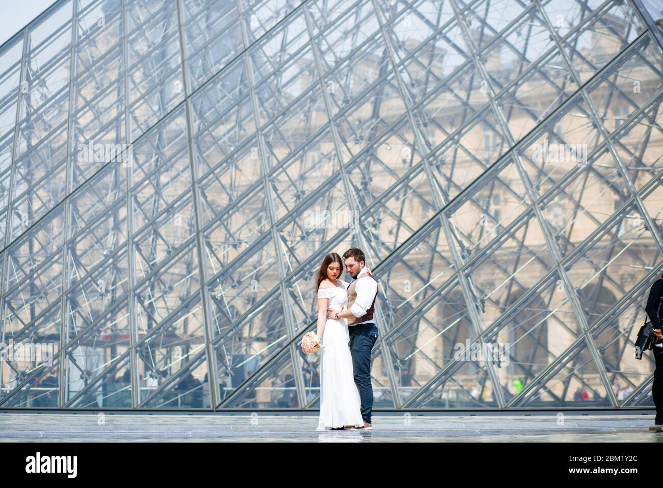 wedding couple. The bride in a beautiful wedding dress, the bride in a stylish tuxedo, Paris France. Stock Photo
