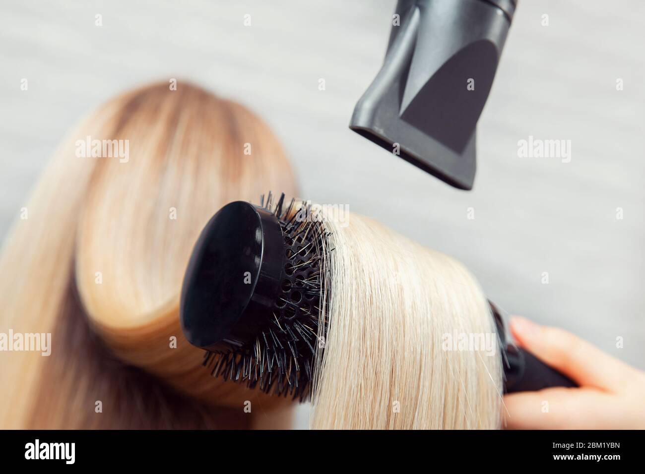 Hair blonde hairdryer brush hi-res stock photography and images - Alamy