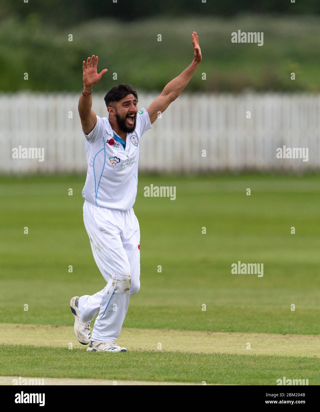 Derbyshire's Anuj Dal celebrates a wicket in a 2nd XI match against Lancashire at Belper Meadows CC 17 June 2019 Stock Photo
