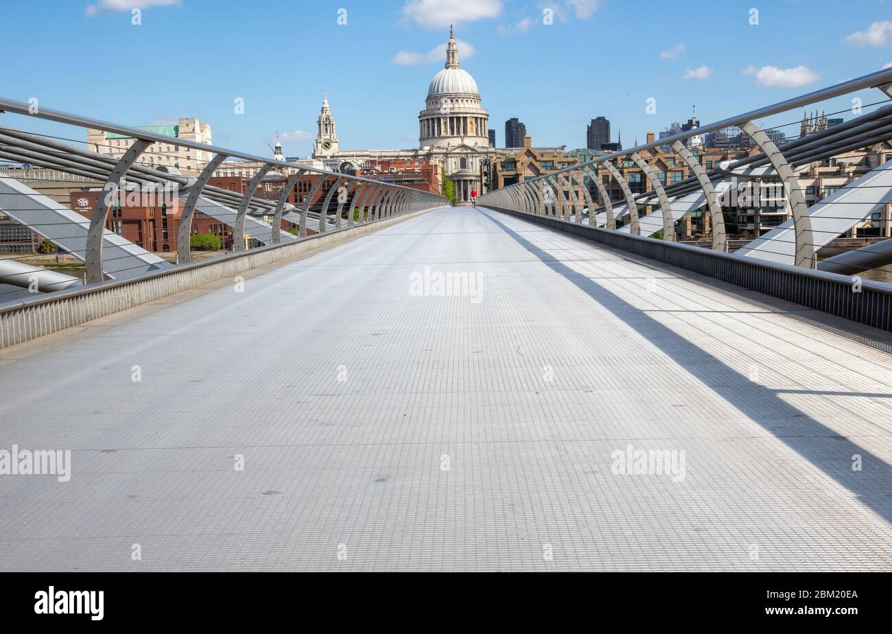 A completely deserted Millennium Bridge at 11 O'Clock on a Monday morning. The Coronavirus pandemic and lockdown has had a big effect on business. Stock Photo