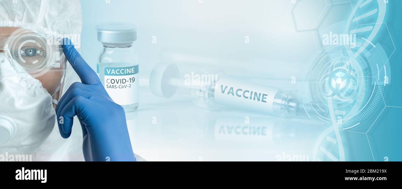 Doctor in a protective suit against the background of a syringe with the inscription Vaccine. Coronavirus vaccine development Stock Photo