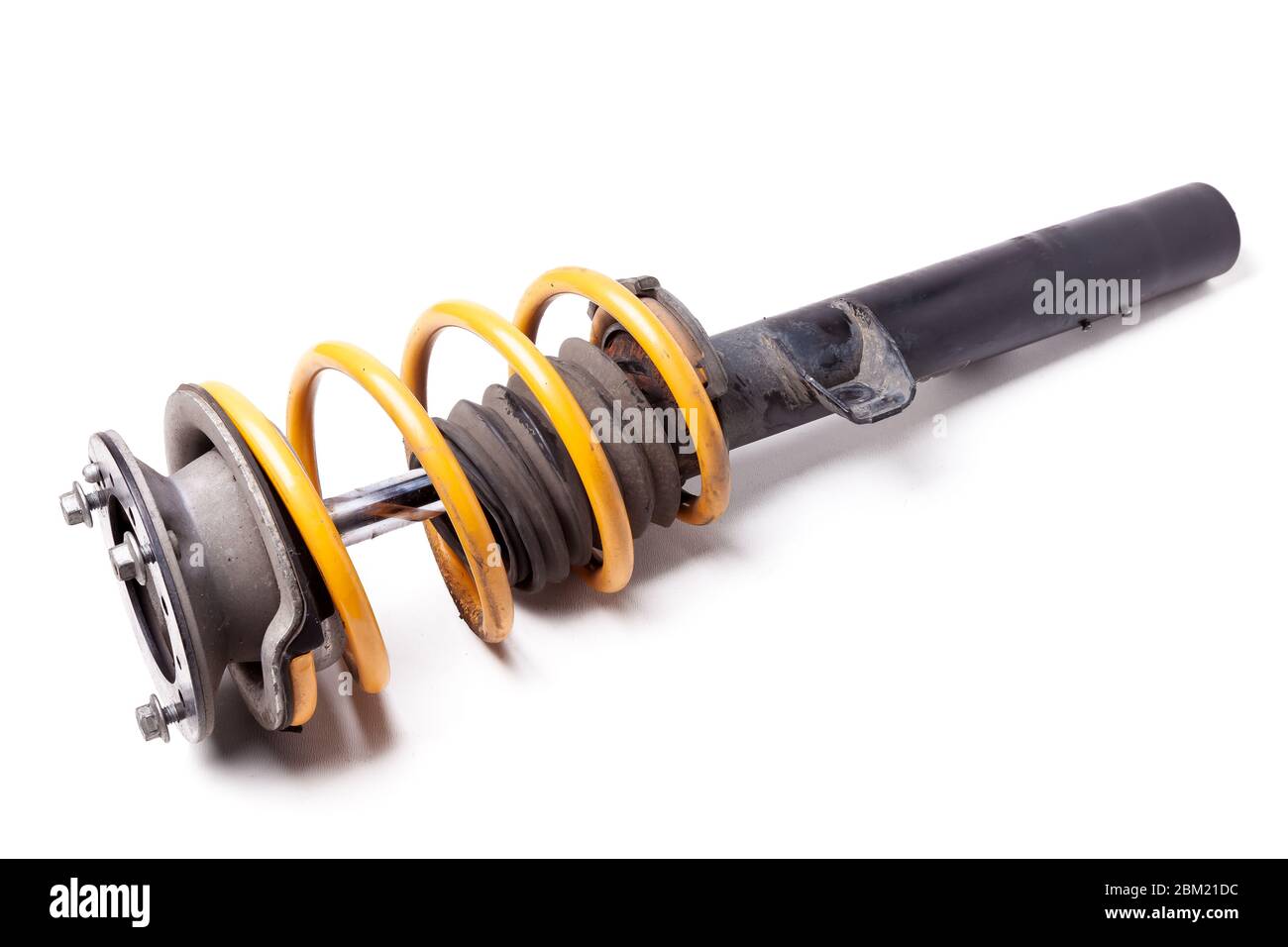 Metal shock absorber for car suspension in black with a yellow spring