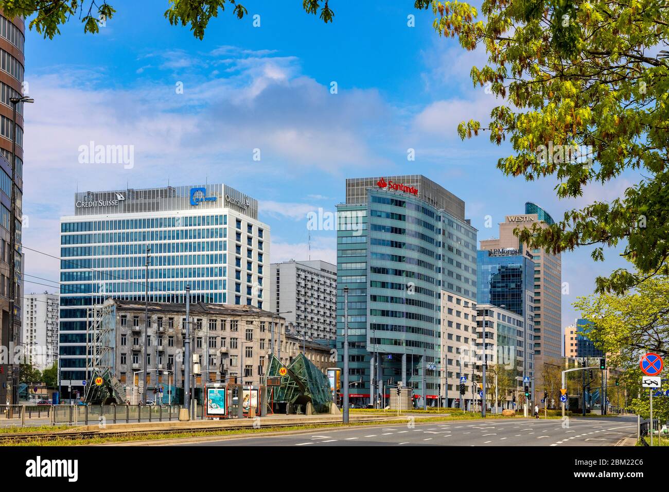 Warsaw, Mazovia / Poland - 2020/05/02: Panoramic view of Srodmiescie downtown district with Rondo ONZ roundabout and surrounding office buildings alon Stock Photo