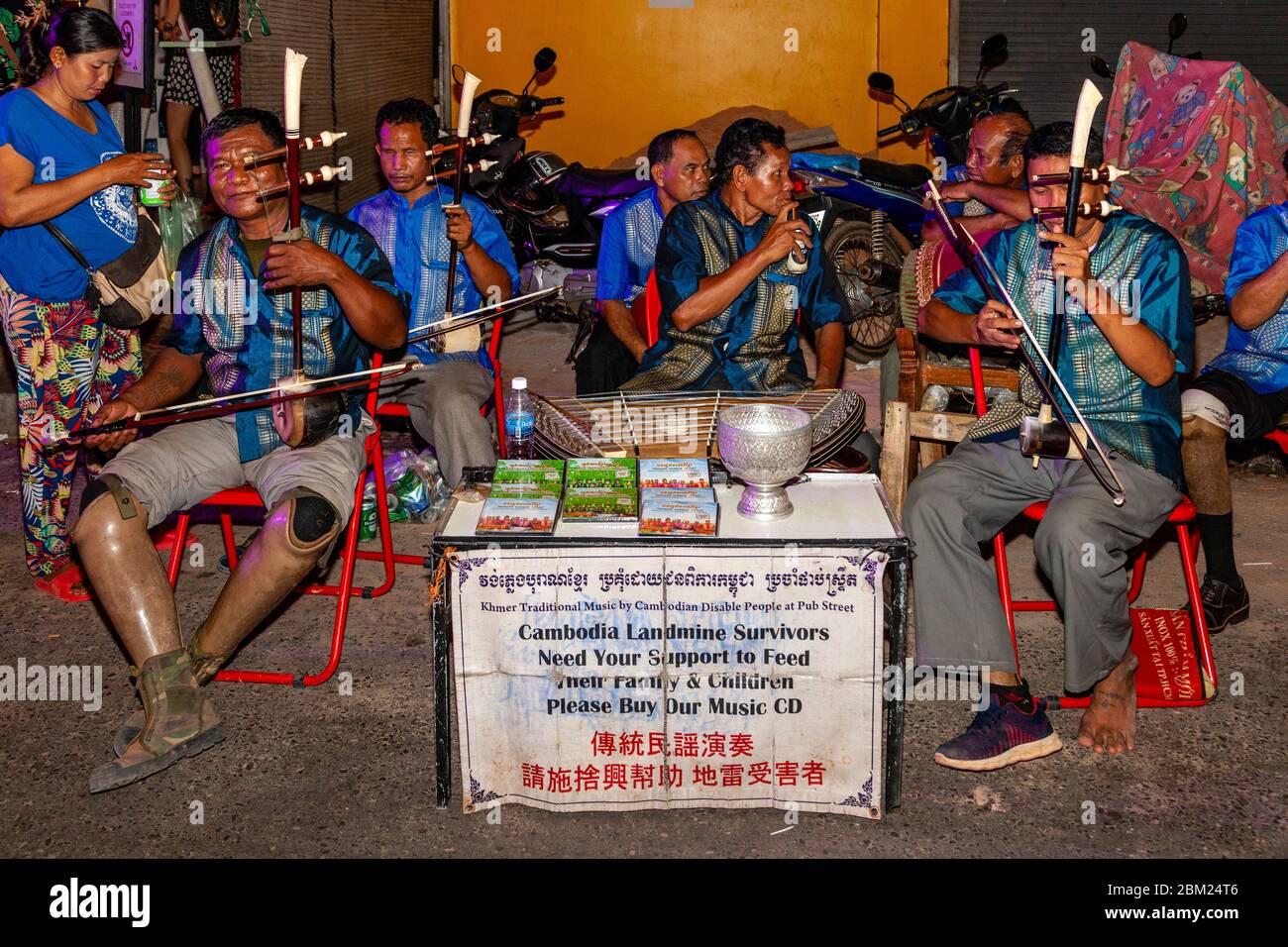Cambodian Landmine Survivors Busking In Pub Street, Siem Reap, Siem Reap Province, Cambodia. Stock Photo