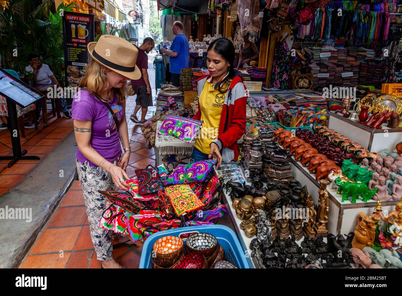 A Female Tourist/Visitor Buying Souvenirs In The Old Market, Siem Reap