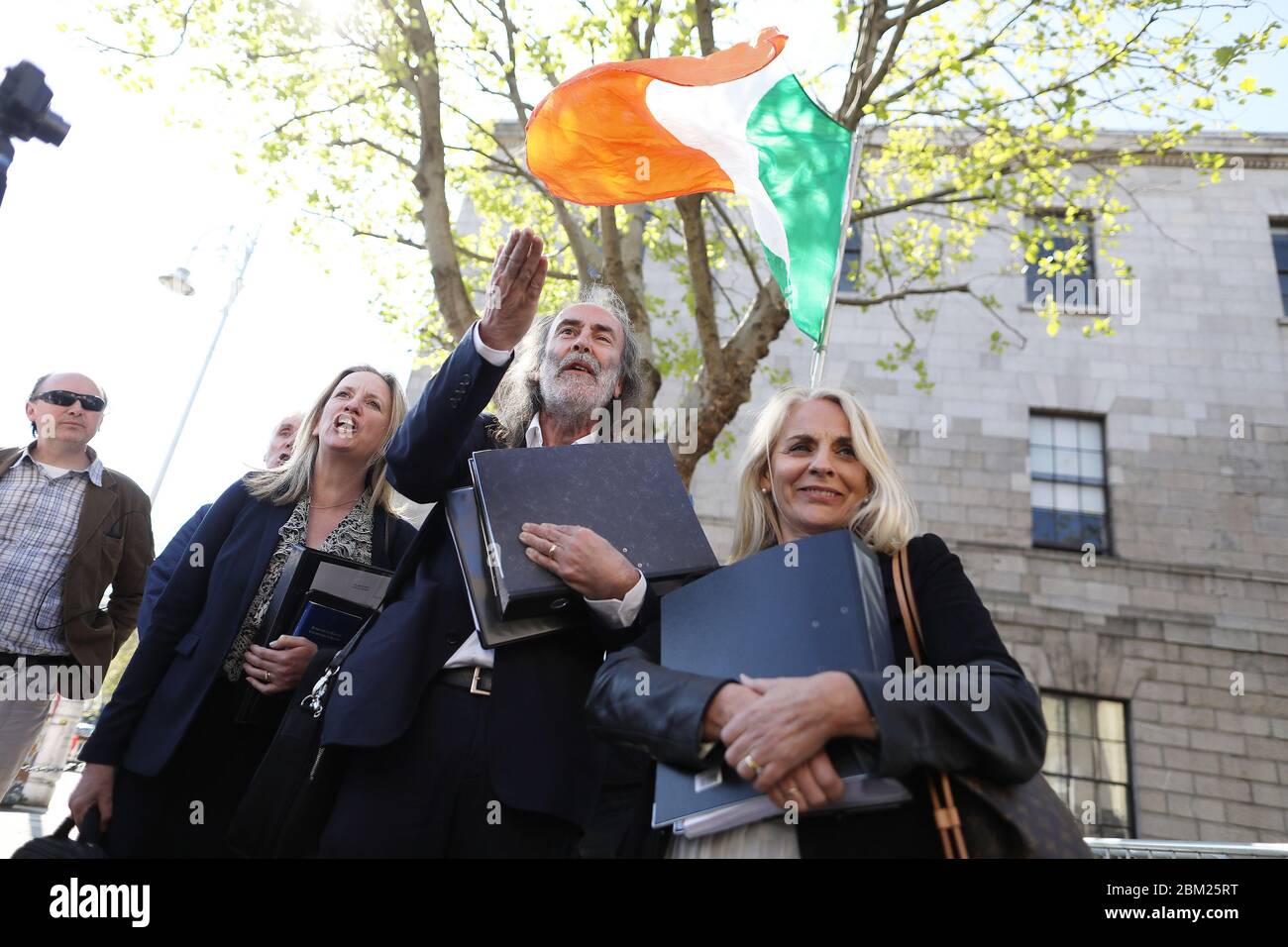John Waters and Gemma O'Doherty speaking to supporters at the High Court in Dublin, where they are seeking to have various pieces of recently enacted legislation, introduced due to the Covid-19 pandemic, quashed by a judge. Stock Photo