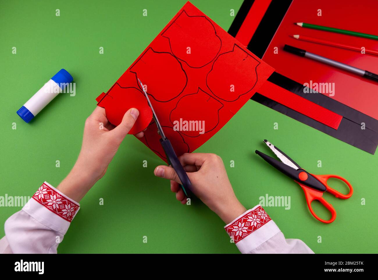 Step 4. Step by step instructions. How to make a red poppy from colored paper. Creative crafts for Victory Day. Memorial Day of the victims of the war Stock Photo