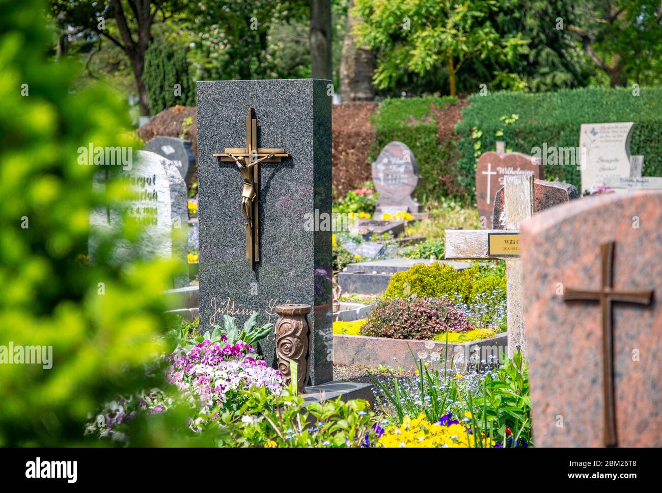 Graves with gravestones and flower decorations at the old cemetery of Oberursel near Frankfurt Stock Photo