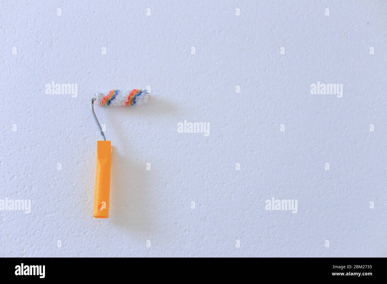Paint roller for painting on a white background Stock Photo