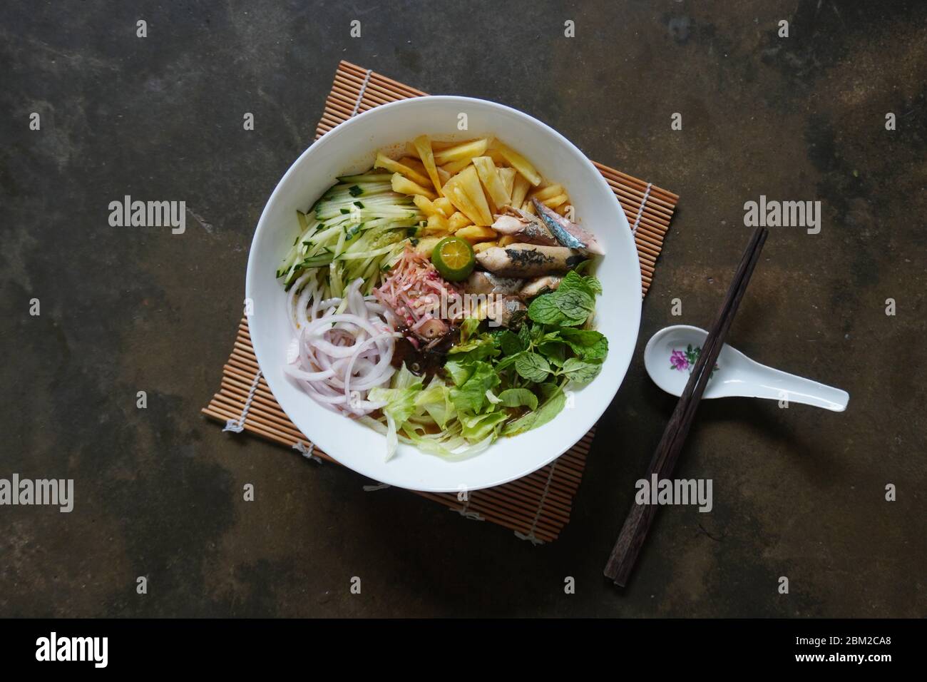 Asam laksa is a sour, fish and tamarind-based soup in Malaysia. Stock Photo