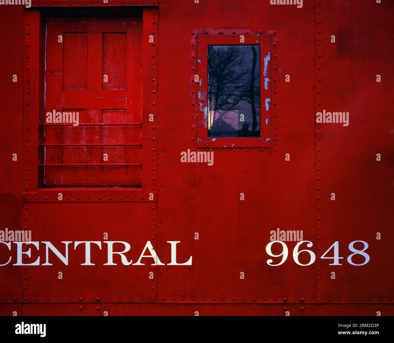 Detail of red railroad car wall with white text Stock Photo