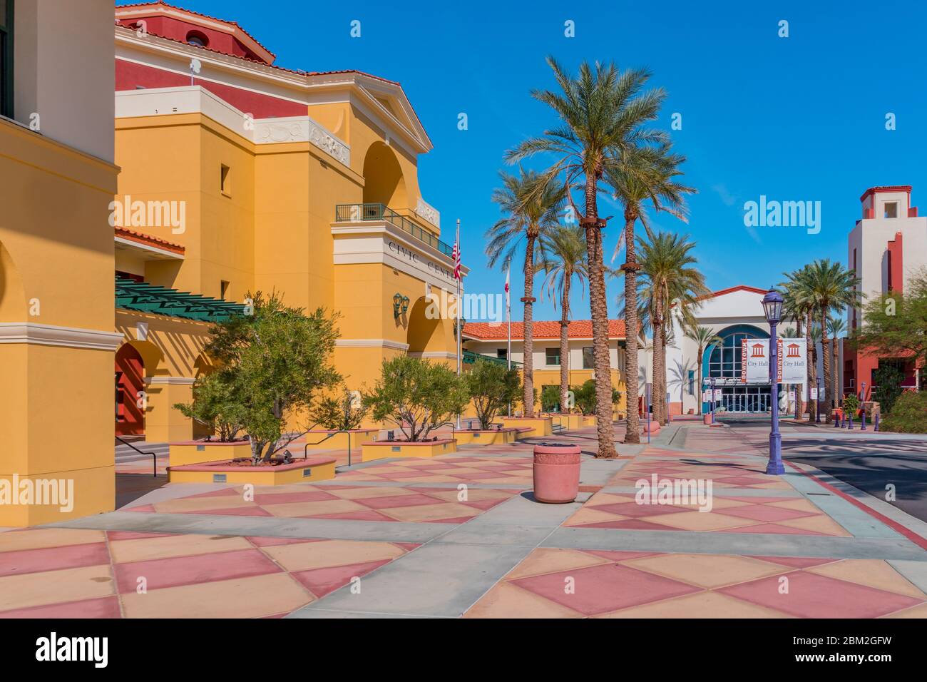 Cathedral City City Center is filled with color and interesting architecture. It is enhanced by palm trees.It is adjacent to Palm Springs. Stock Photo