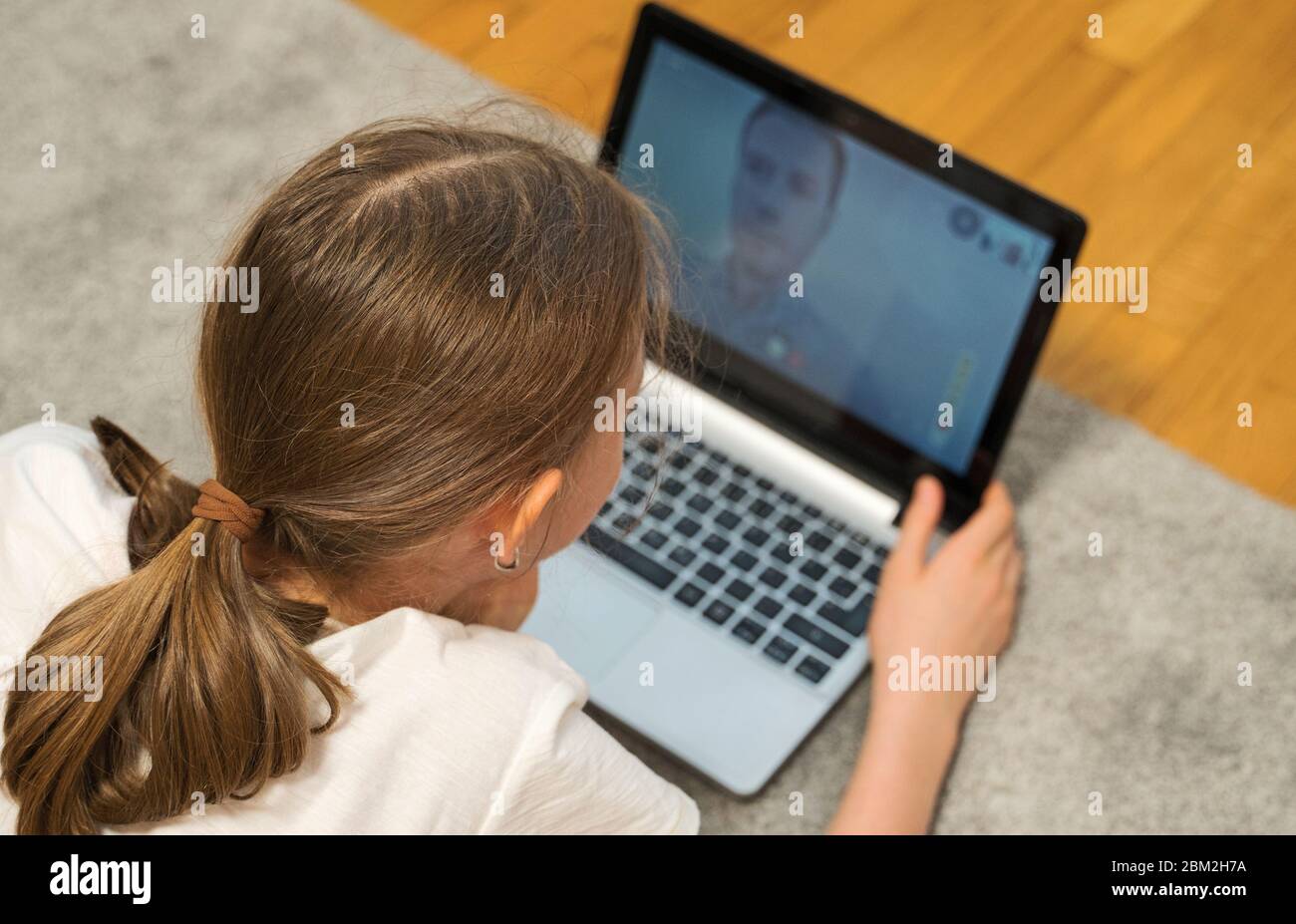 Daughter communicate with her father. Video call. Stock Photo