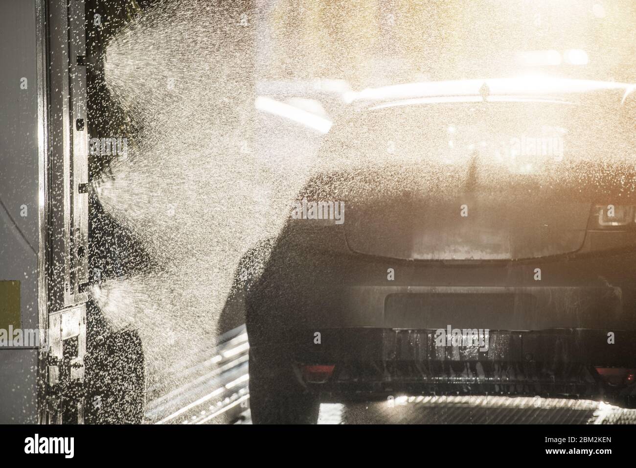 Vehicle Going Through Touch Free Automatic Express Car Wash Being