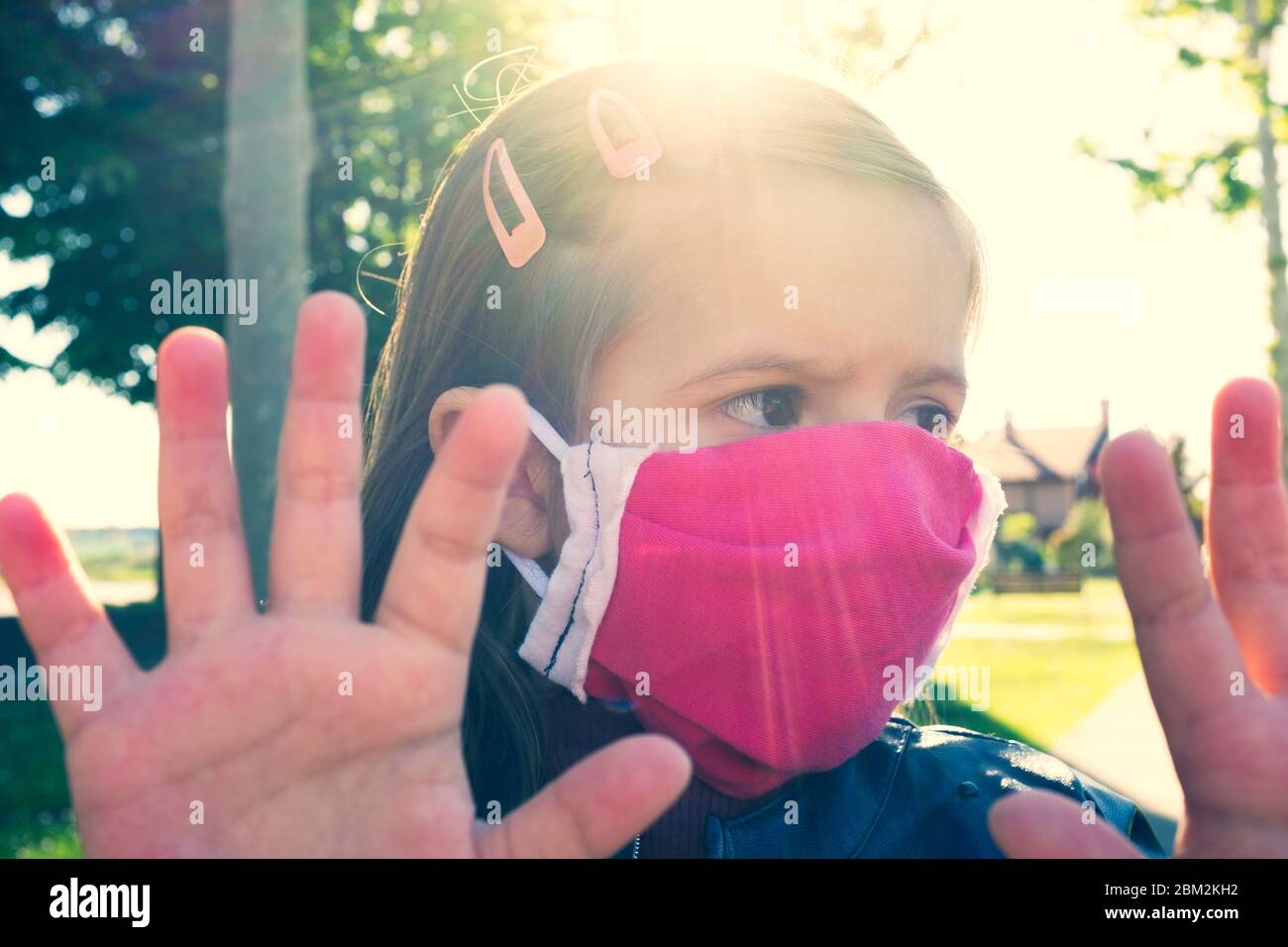 Little caucasian girl wearing medical handmade face mask protect for ...