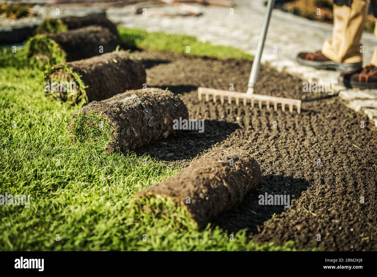 Raking dirt hires stock photography and images Alamy