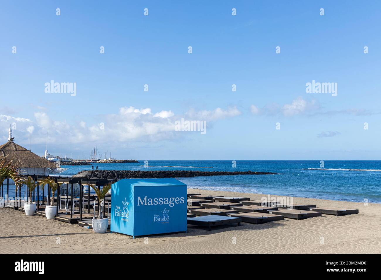 Playa Fanabe massage business and sunbeds deserted, closed during the Covid 19 State of Emergency in Tenerife, Canary Islands, Spain Stock Photo