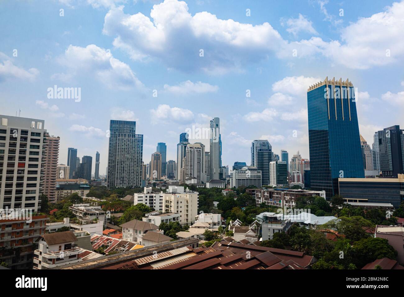 Bangkok city skyline, view on skyscrapers in Thailand capital city panorama during day with blue clody sky background Stock Photo