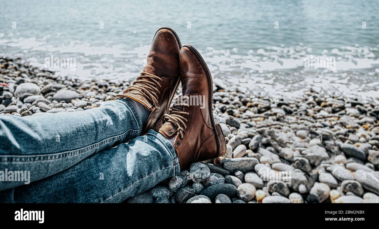 traveler is cross legged tired at the end of the journey. banner Stock Photo