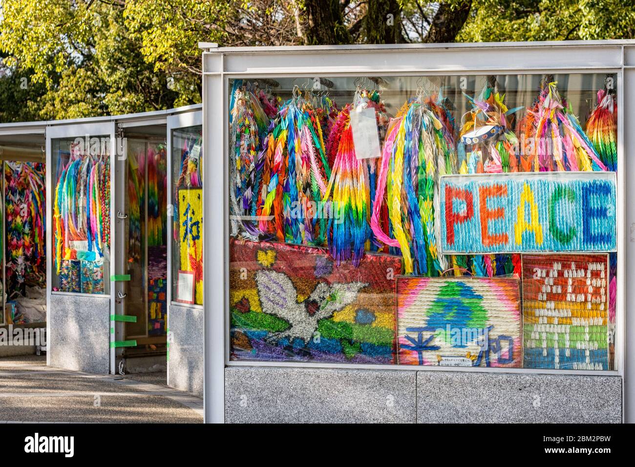 Hiroshima / Japan - December 21, 2017: Brightly colored paper cranes at the Children's Peace Monument to commemorate Sadako Sasaki and thousands of ch Stock Photo