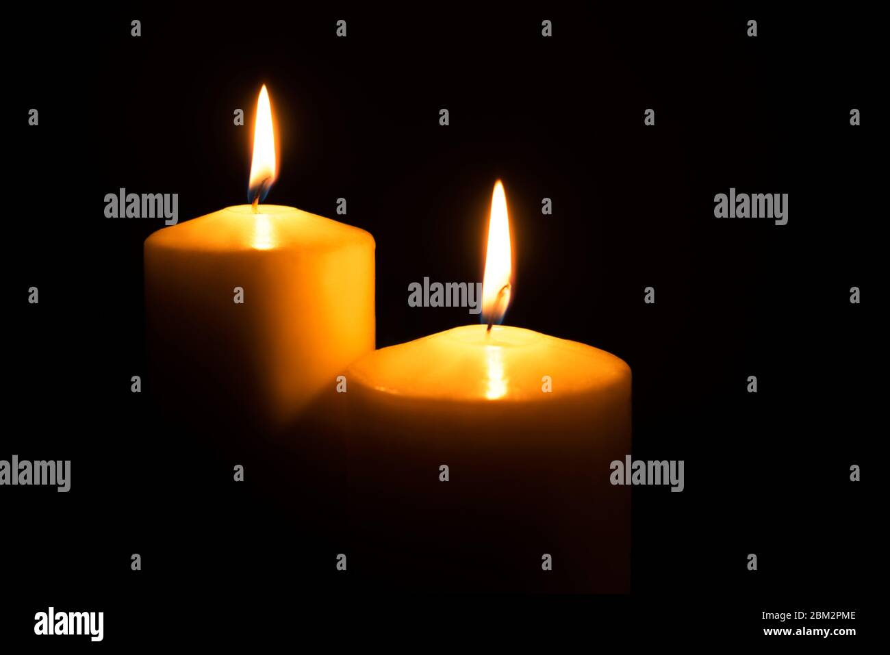 Flame candles isolated on black background Stock Photo - Alamy