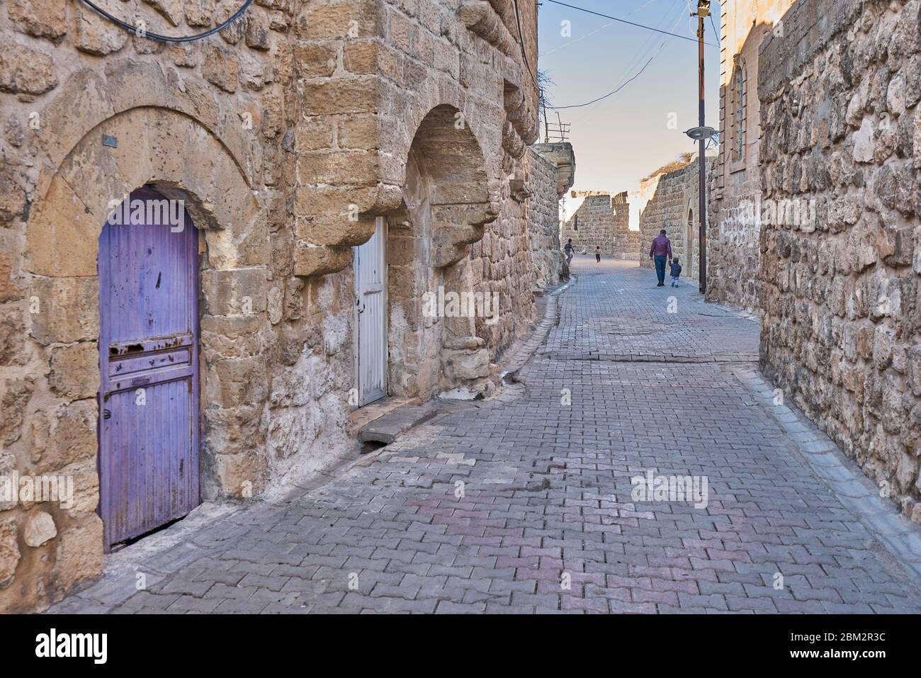 Old narrow streets, traditional stone houses and doors of Midyat, Mardin, Turkey Stock Photo