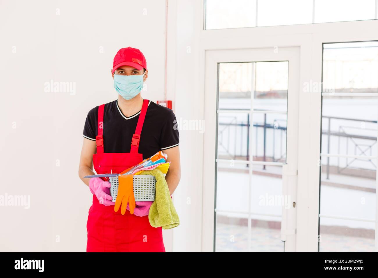 Cleaning and Disinfection at town complex amid the coronavirus epidemic. Professional teams for disinfection efforts. Infection prevention and control Stock Photo