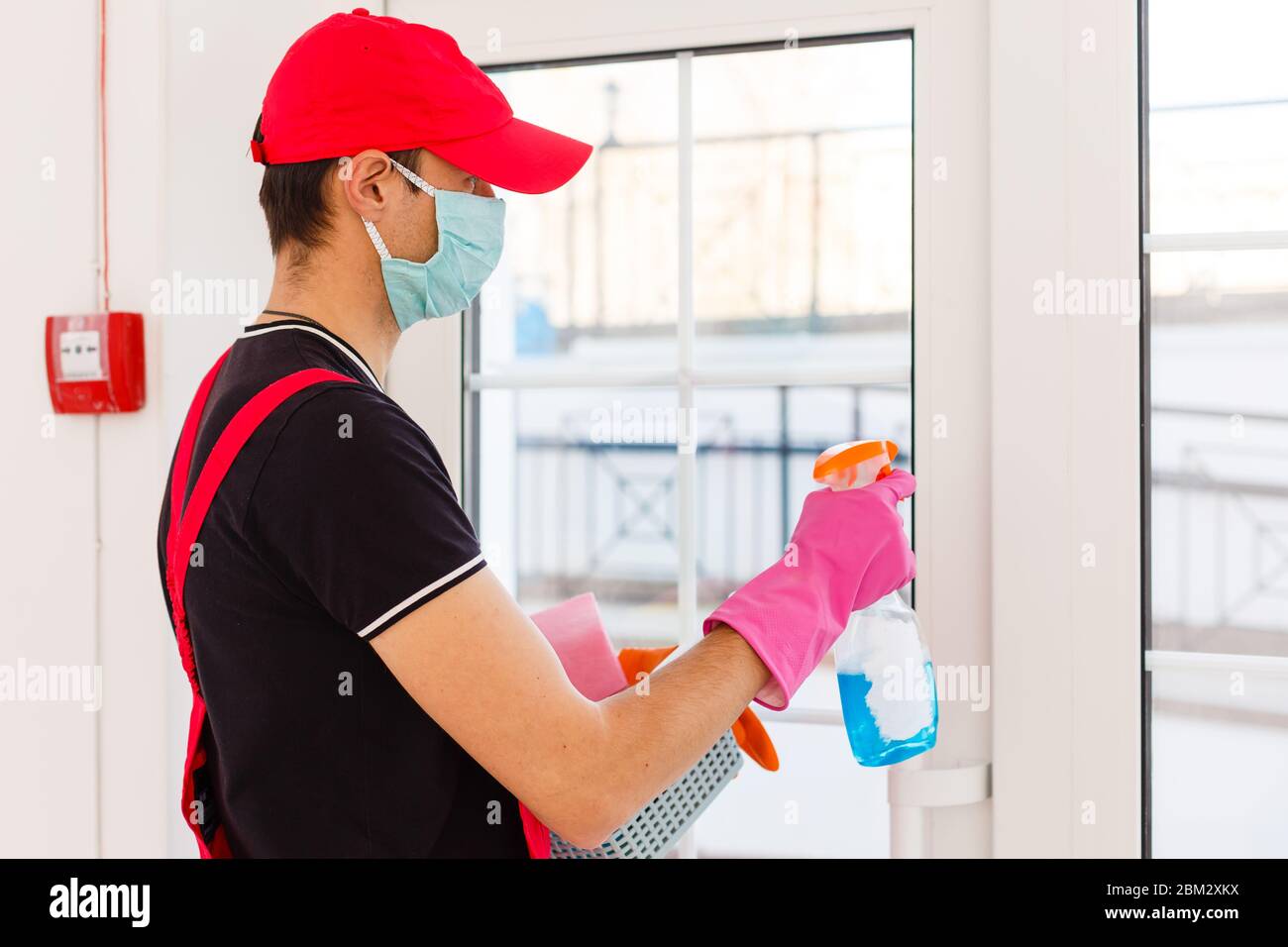 Cleaning and Disinfection at town complex amid the coronavirus epidemic. Professional teams for disinfection efforts. Infection prevention and control Stock Photo