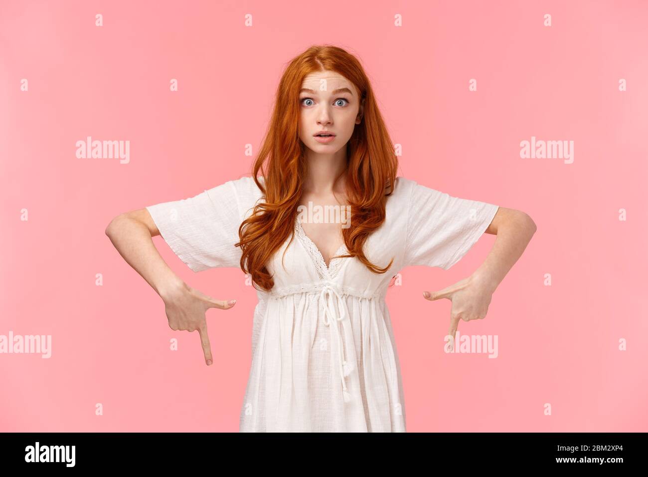 Curious and intrigued redhead girl heard interesting news, raise